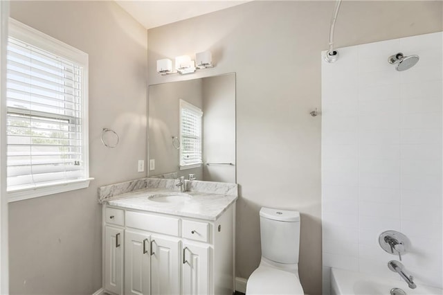 full bath featuring vanity, toilet, and bathing tub / shower combination