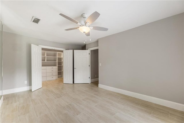 unfurnished bedroom with baseboards, a ceiling fan, a closet, and light wood-style flooring