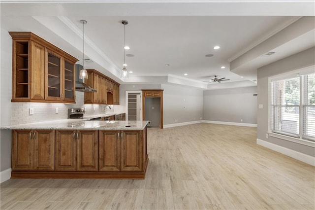 16720 Quayside Dr, Alpharetta, GA 30004 - kitchen with brown cabinetry, a peninsula, light stone counters, stainless steel electric range oven, and light wood-type flooring