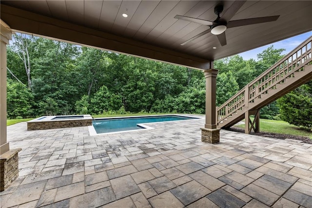 view of pool with stairs, ceiling fan, a patio area, and a pool with connected hot tub