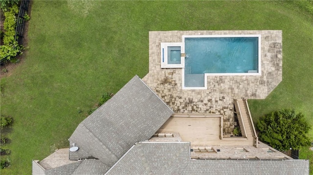 view of subject property with a pool area