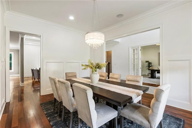 16720 Quayside Dr, Alpharetta, GA 30004 - dining area featuring a decorative wall, a chandelier, dark wood-style flooring, crown molding, and a wainscoted wall