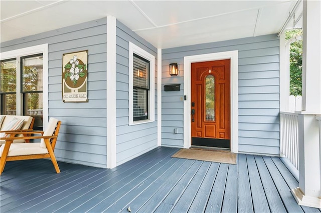 entrance to property featuring covered porch