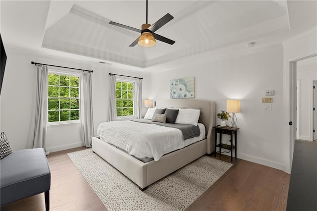 4433 Windsor Oaks Cir, Marietta, GA 30066 - bedroom featuring a tray ceiling, wood finished floors, ornamental molding, baseboards, and ceiling fan