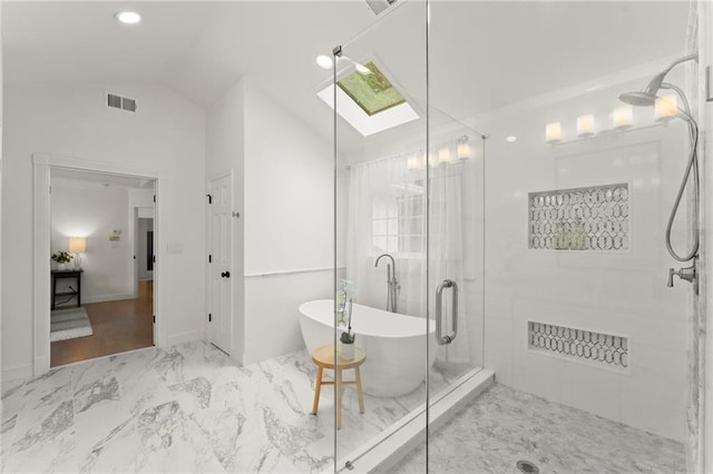 4433 Windsor Oaks Cir, Marietta, GA 30066 - full bathroom featuring marble finish flooring, lofted ceiling, a shower stall, a soaking tub, and a skylight