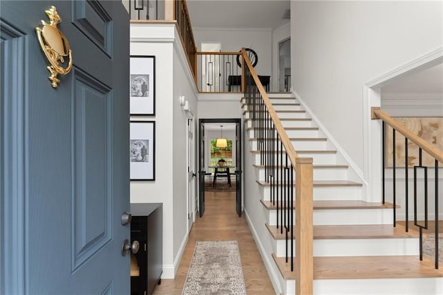 4433 Windsor Oaks Cir, Marietta, GA 30066 - foyer entrance featuring stairs, light wood-type flooring, baseboards, and ornamental molding