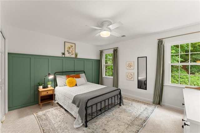 4433 Windsor Oaks Cir, Marietta, GA 30066 - bedroom featuring a ceiling fan, a decorative wall, and wainscoting