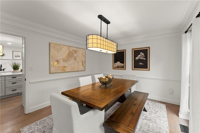4433 Windsor Oaks Cir, Marietta, GA 30066 - dining space featuring ornamental molding, wood finished floors, and baseboards