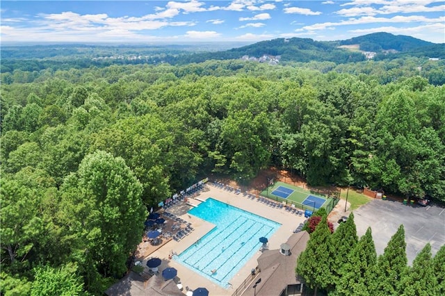 4433 Windsor Oaks Cir, Marietta, GA 30066 - aerial view of a forest, a pool, and a mountainous background