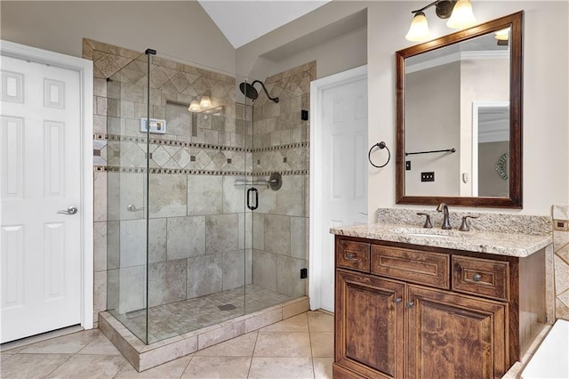 bathroom featuring lofted ceiling, an enclosed shower, tile patterned floors, and vanity