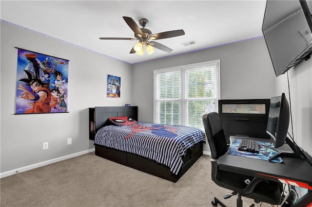 bedroom featuring ceiling fan and light carpet