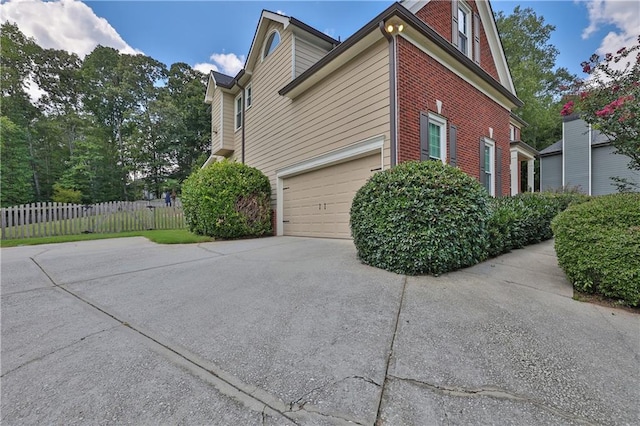 view of side of home with a garage