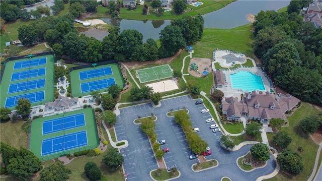 birds eye view of property with a water view