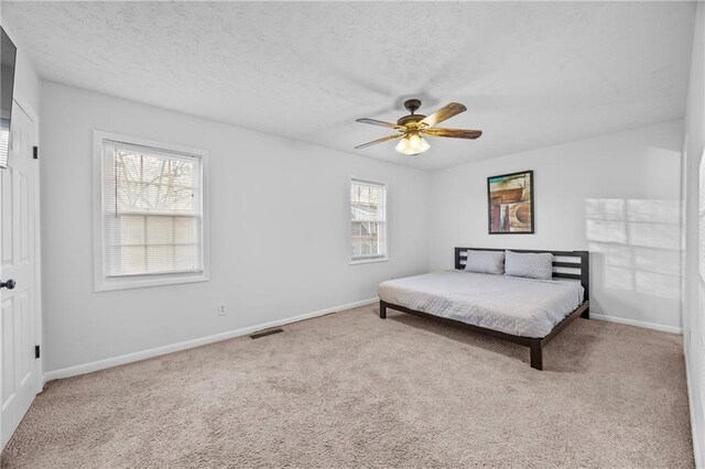 2858 Spring Villa Ln SE, Smyrna, GA 30080 - carpeted bedroom featuring baseboards and a ceiling fan