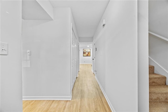 2858 Spring Villa Ln SE, Smyrna, GA 30080 - hall with light wood-style floors, stairway, and baseboards