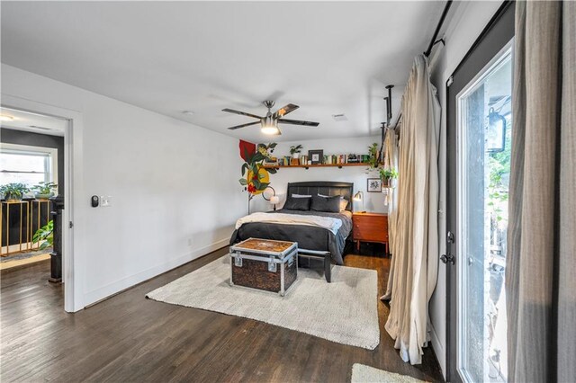 bedroom with access to outside, ceiling fan, and dark hardwood / wood-style floors