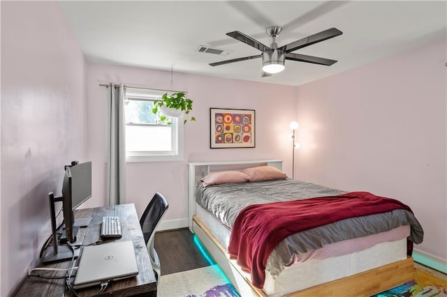 bedroom featuring ceiling fan and dark wood-type flooring