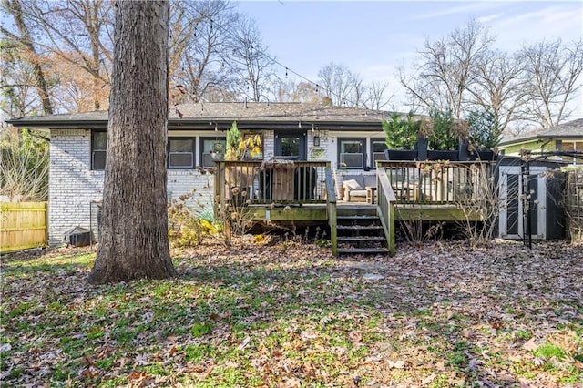 back of property featuring a wooden deck