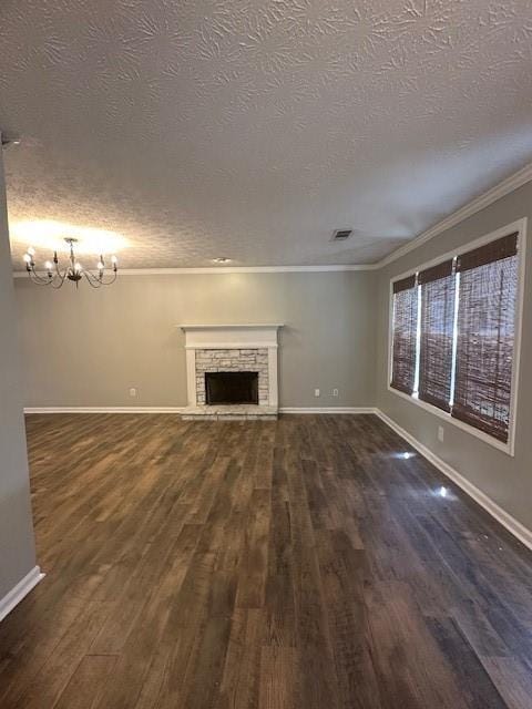 1732 Wyntercreek Ln, Hoschton, GA 30548 - unfurnished living room featuring crown molding, a textured ceiling, dark wood-type flooring, and visible vents