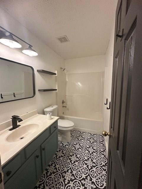 1732 Wyntercreek Ln, Hoschton, GA 30548 - full bathroom with toilet, visible vents, tile patterned flooring, vanity, and shower / bathing tub combination