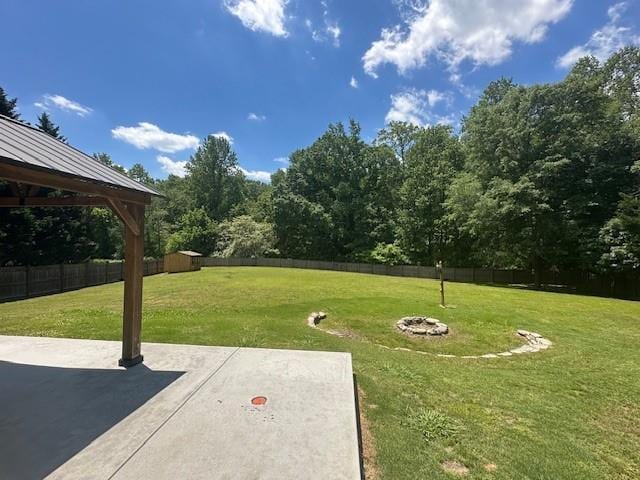 1732 Wyntercreek Ln, Hoschton, GA 30548 - view of yard with a gazebo, an outbuilding, a patio, and a fenced backyard