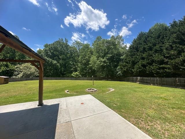 1732 Wyntercreek Ln, Hoschton, GA 30548 - view of yard with a patio area and a fenced backyard