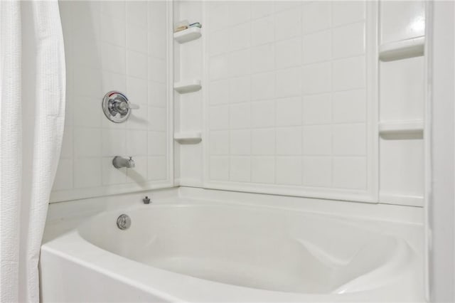 bathroom featuring shower / bathtub combination with curtain