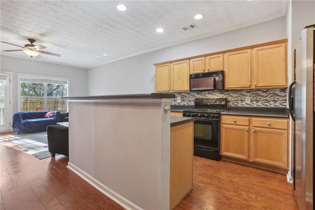 kitchen with ceiling fan, a textured ceiling, decorative backsplash, black appliances, and hardwood / wood-style flooring