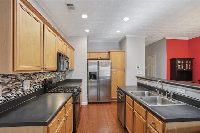 kitchen with sink, hardwood / wood-style flooring, crown molding, and black appliances