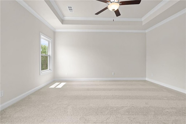 636 Silva St, Cumming, GA 30040 - empty room with a tray ceiling, carpet floors, ceiling fan, crown molding, and baseboards