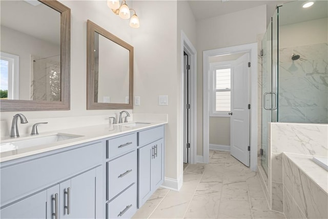 636 Silva St, Cumming, GA 30040 - full bathroom with marble look tiles, double vanity, baseboards, and a shower stall