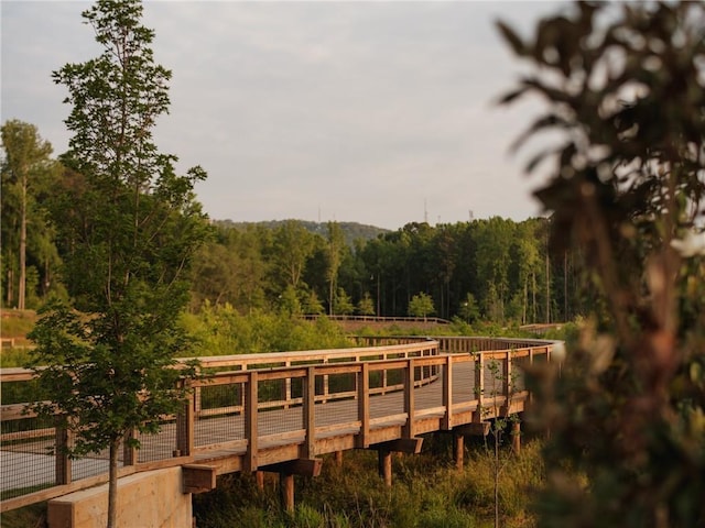 view of dock with a forest view