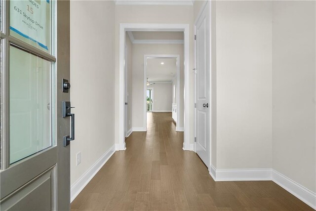636 Silva St, Cumming, GA 30040 - corridor with ornamental molding, wood finished floors, and baseboards