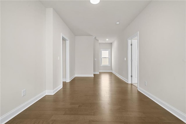 636 Silva St, Cumming, GA 30040 - empty room featuring dark wood-style flooring and baseboards