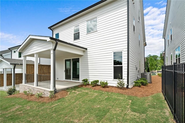 636 Silva St, Cumming, GA 30040 - rear view of property featuring a patio and cooling unit