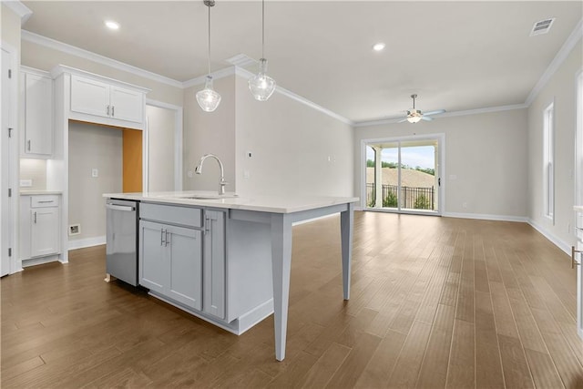 636 Silva St, Cumming, GA 30040 - kitchen featuring a sink, stainless steel dishwasher, light countertops, ceiling fan, and dark wood-type flooring