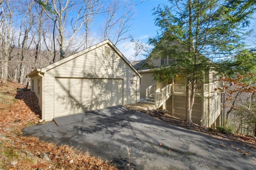 exterior space featuring covered porch and a garage