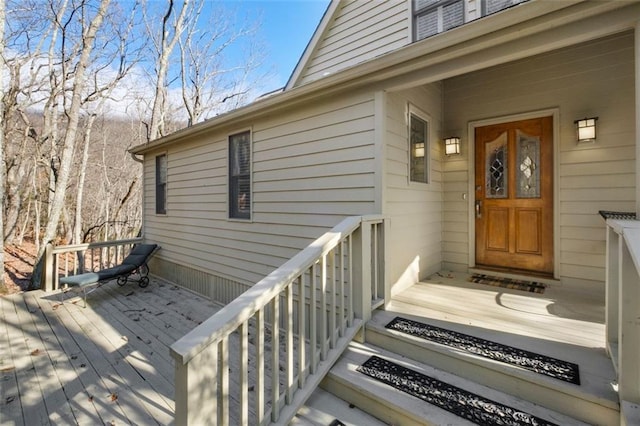 property entrance with a wooden deck