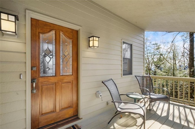 doorway to property featuring covered porch