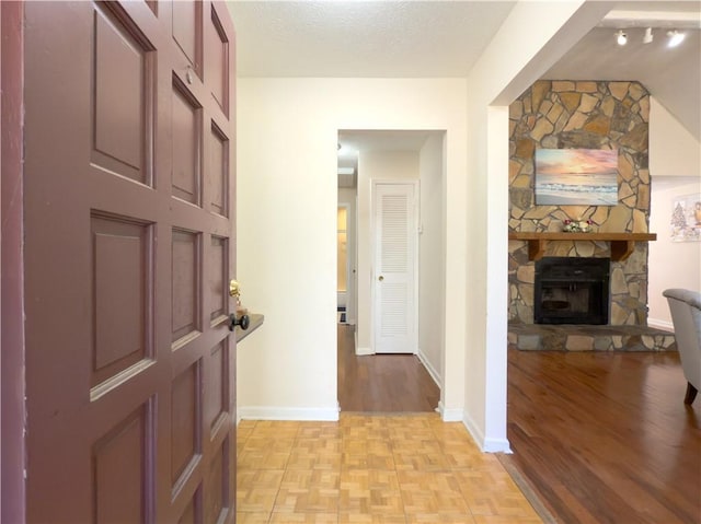 hall with a textured ceiling