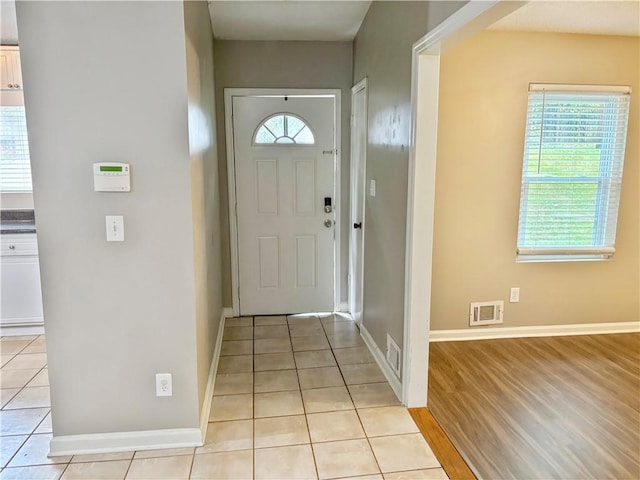 unfurnished living room with a fireplace, dark wood-type flooring, and ceiling fan