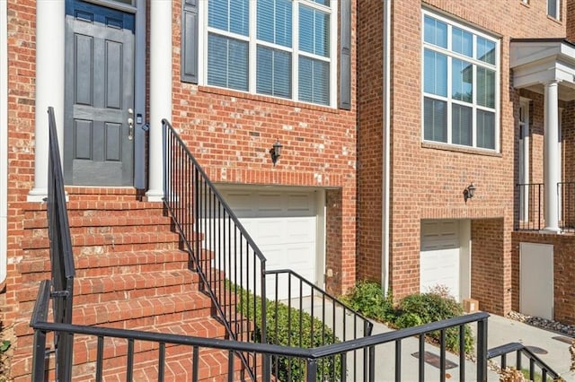 doorway to property featuring a garage