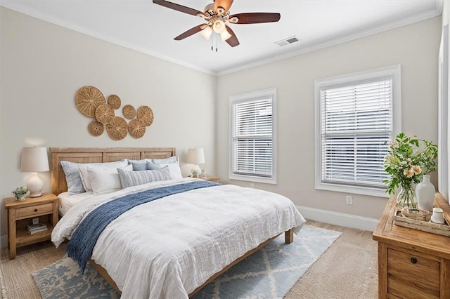 bedroom with multiple windows, crown molding, light carpet, and ceiling fan