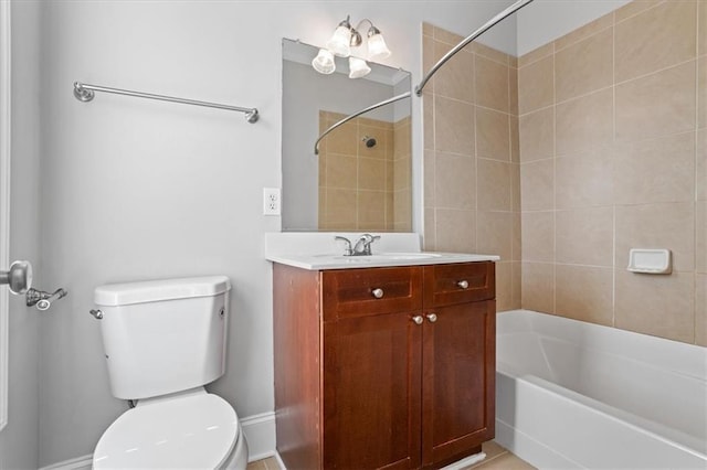 full bathroom with vanity, tiled shower / bath combo, and toilet