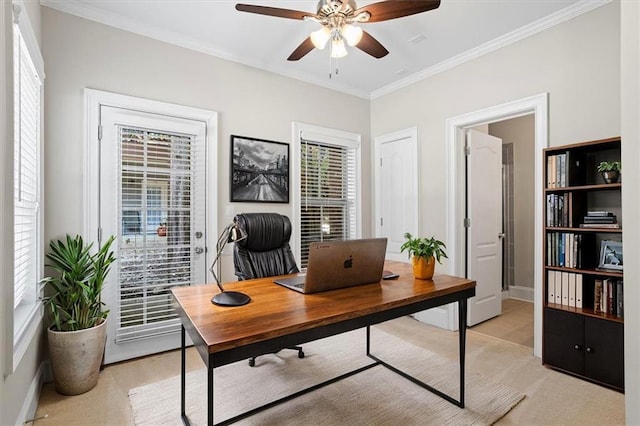 home office with ceiling fan, ornamental molding, and a healthy amount of sunlight