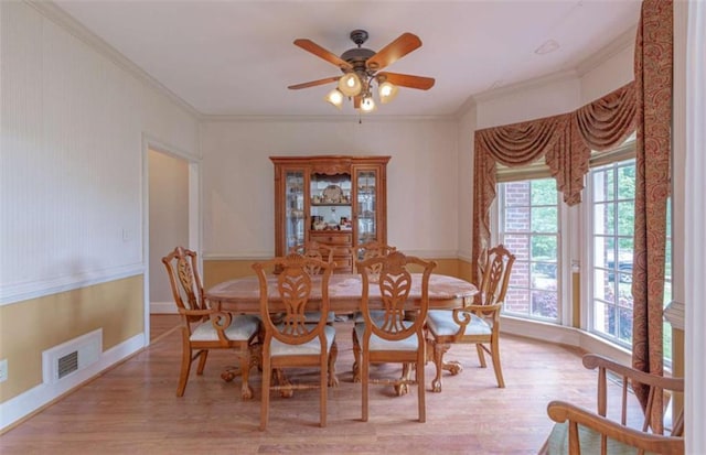 516 Turner Rd, Concord, GA 30206 - dining room with healthy amount of natural light, crown molding, light wood-type flooring, and a ceiling fan