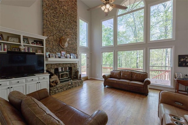 516 Turner Rd, Concord, GA 30206 - living area featuring a high ceiling, ceiling fan, plenty of natural light, and wood finished floors