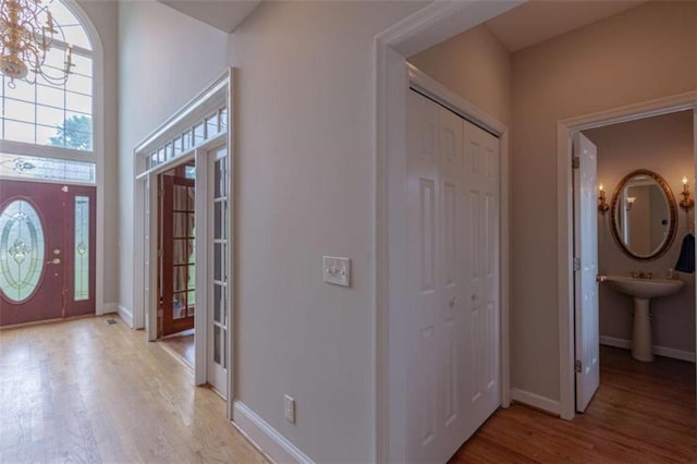 516 Turner Rd, Concord, GA 30206 - entrance foyer with light wood-style flooring, baseboards, and a chandelier