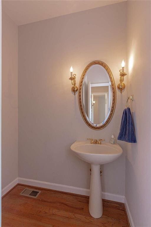 516 Turner Rd, Concord, GA 30206 - bathroom with wood finished floors and baseboards