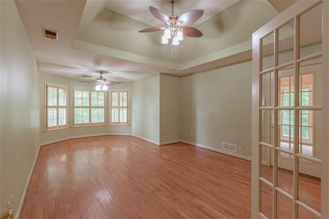 516 Turner Rd, Concord, GA 30206 - spare room featuring ceiling fan, a tray ceiling, and baseboards
